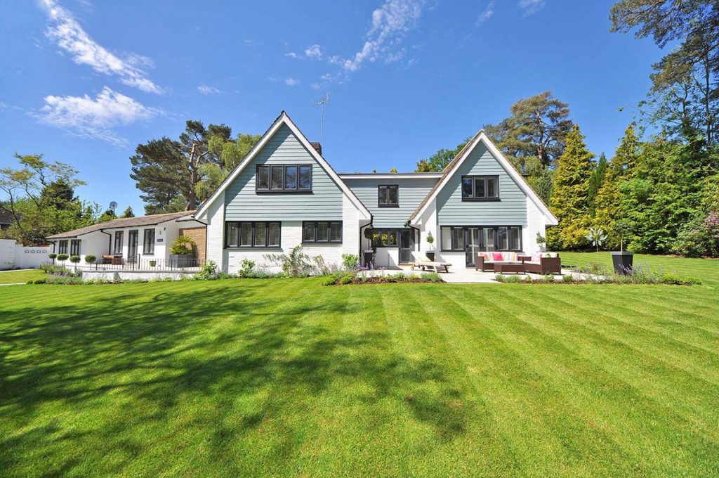 Twin A-frame house with white sidings