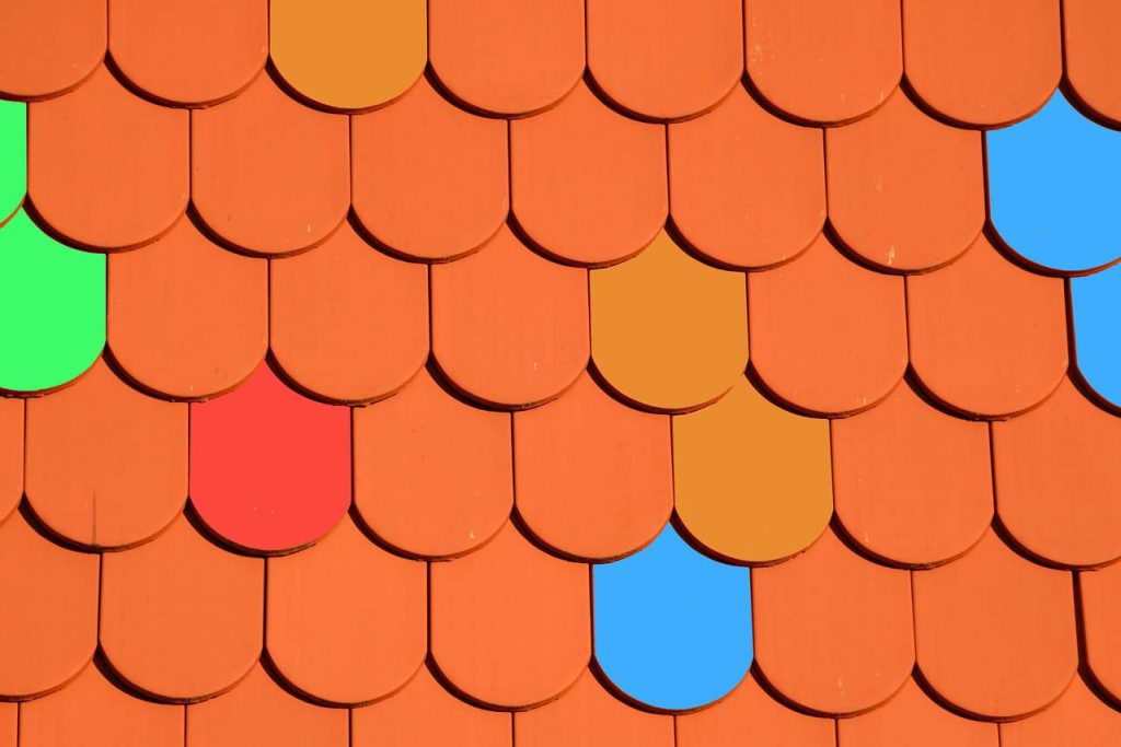 gree, blue, red, and terracotta colored roof shingles
